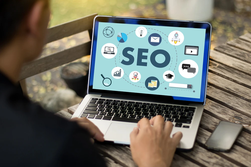 person using laptop for seo