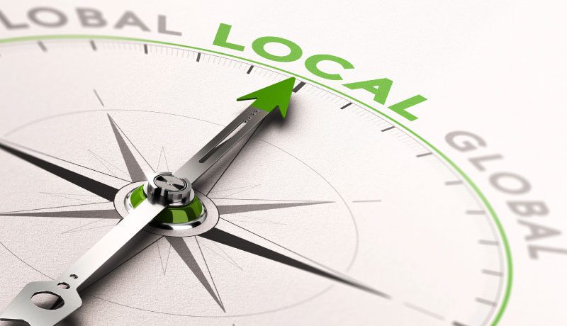 compass pointing o the word Local